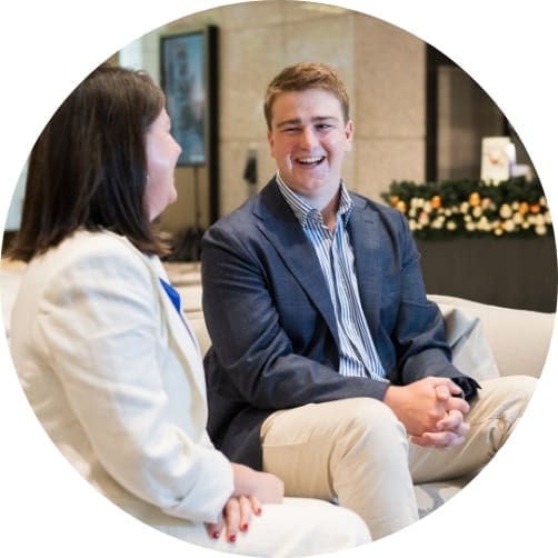 Image of man laughing in conversation